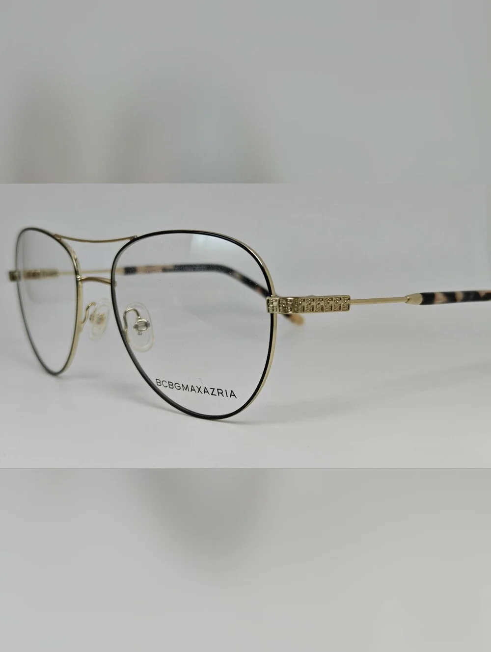 BCBGMAXAZRIA Call Aviator Eyeglass Frames in Black and Gold. Feminine.